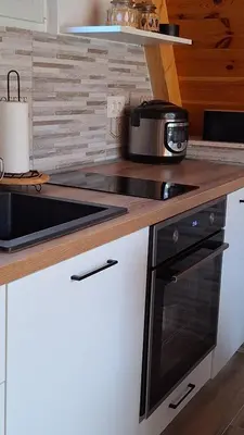 a kitchen counter with a stove and a pot on it at Bella Home in Rap