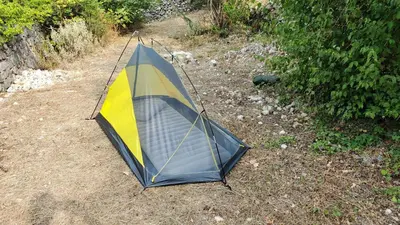 a blue and yellow tent sitting on the ground at Montenegro Tower in Pečurice