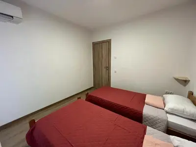 a room with two beds in a room at Sea in Bar