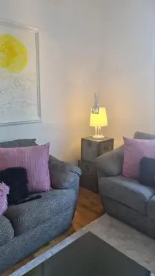 a living room with a couch and a chair at Apartment Kata in Cetinje