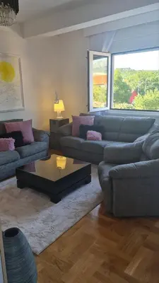 a living room with couches and a coffee table at Apartment Kata in Cetinje