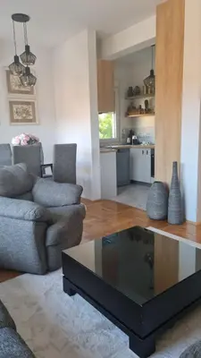 a living room with a couch and a coffee table at Apartment Kata in Cetinje