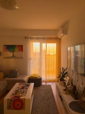 a living room with a couch and a table at Marelica Apartman in Bar