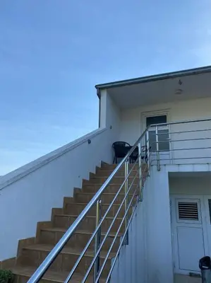 a staircase on the side of a building at Apartment Maša in Radanovići