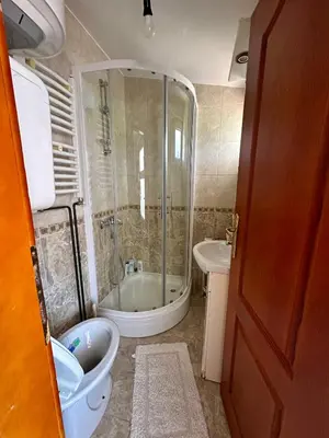 a bathroom with a tub and a toilet and a sink at Apartment Maša in Radanovići