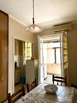 a kitchen with a table with a bowl on it at Center Square in Podgorica