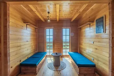 an empty room with blue benches in a sauna at Panora Oliva in Rap