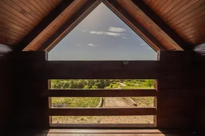 a window in a building with a view of a train track at Panora Oliva in Rap