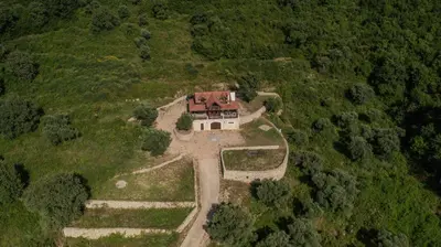 an aerial view of a house in the middle of a field at Panora Oliva in Rap