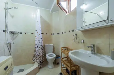 a bathroom with a sink and a toilet and a shower at Panora Oliva in Rap
