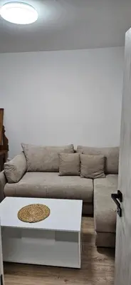 a living room with a couch and a coffee table at Apartman Olivera in Sutomore