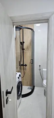 a bathroom with a shower and a toilet at Apartman Olivera in Sutomore