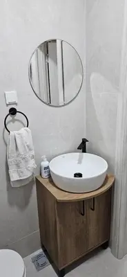 a bathroom with a white sink and a mirror at Apartman Olivera in Sutomore