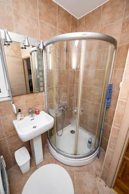 a bathroom with a shower and a sink at Sky Center Apartment in Podgorica