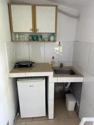 a small kitchen with a sink and a counter at Apartmani Resetar 2 in Brca