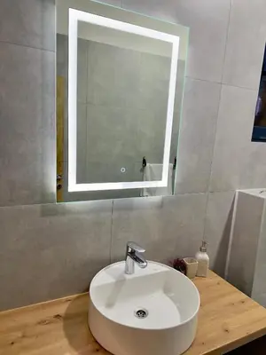 a bathroom with a sink and a mirror at Villa LuceSole Budva in Budva