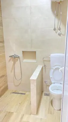 a bathroom with a toilet and a shower at Apartments Drini in Ulcinj