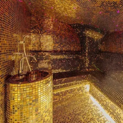 a bathroom with gold tiled walls and a tub at Luxury apartment with 2 rooms in hotel Tre canne in Budva