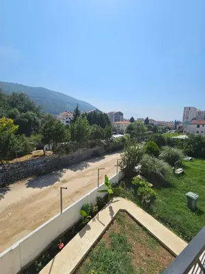 a view of a beach from the balcony of a building at La Vida Apartments in Babalonija
