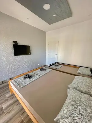 a room with a ping pong table and a tv at KAP Apartments in Sutomore