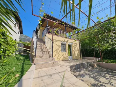 a house with stairs leading up to a building at Montebar1 in Bar