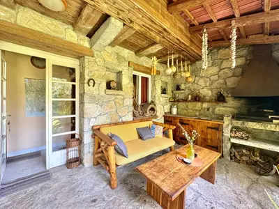 a living room with a couch and a table at Artistic Garden House in Cetinje