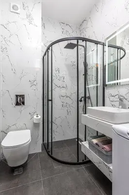 a bathroom with a shower and a toilet and a sink at Adriatic Residence in Budva