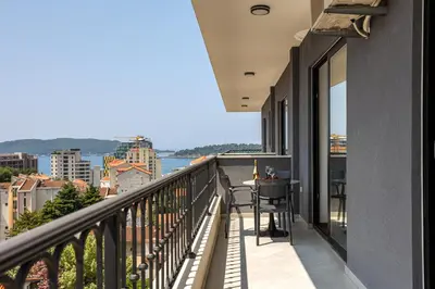 a balcony with a view of the city at Adriatic Residence in Budva