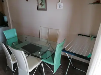 a glass table and chairs in a room at Villa Delfin 1-2-3-4 in Bar