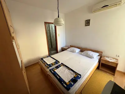 a bedroom with a bed in a room at Guest House Plima 2 in Budva