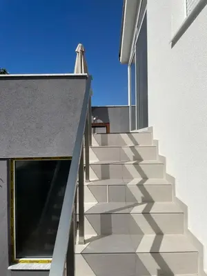 a staircase leading up to a building with a window at Grapefruit Home Apartment Ulcinj Montenegro in Donji Štoj