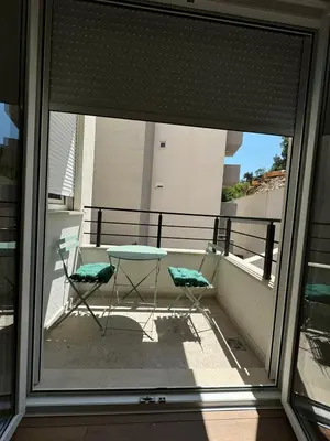 a view of a balcony with a table and two chairs at One bedroom Apartment 777 in Budva
