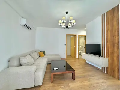 a living room with a couch and a tv at One bedroom Apartment 777 in Budva