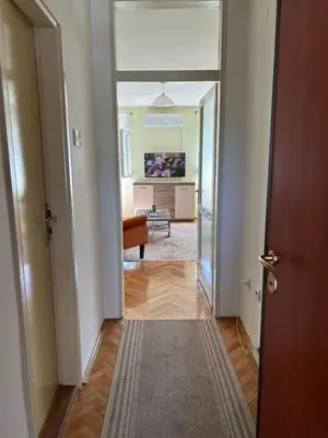 a hallway with a door leading to a living room at Apartman Bešović Cetinje in Cetinje