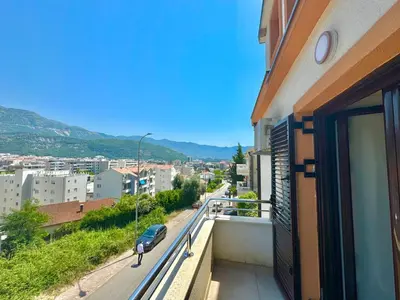 a balcony of a building with a view of a street at Apartments Martinovic Toplis in Budva