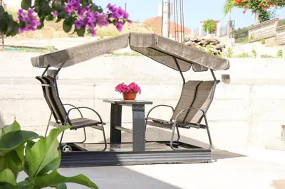 a table and two chairs and a table with a tent at Villa Grafenberg Ulcinj in Ulcinj