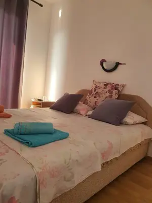 a bed with two towels sitting on top of it at Villa Grafenberg Ulcinj in Ulcinj
