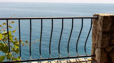 a view of the ocean from a balcony at Sveti Luka private beach in Dobra Voda