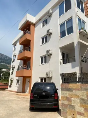 a black van parked in front of a building at Nike's Apartment in Dobra Voda