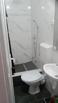 a bathroom with a shower and a toilet and a sink at Studio Dream I I in Bar, Susanj
