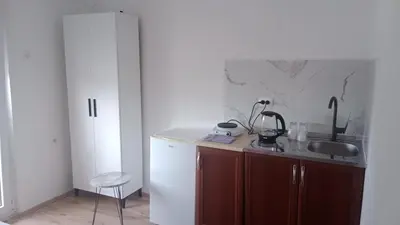 a kitchen with a sink and a white refrigerator at Studio Dream I I in Bar, Susanj