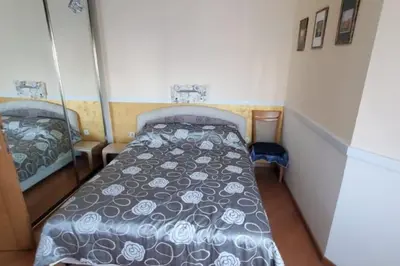 a small bedroom with a bed in a room at P&N Bu2 in Budva