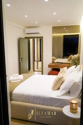 a bedroom with a large white bed in a room at OleaMar in Bar