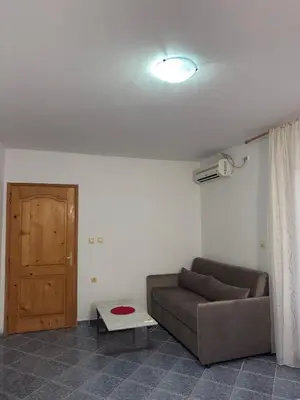 a living room with a couch and a table at Velic in Ulcinj