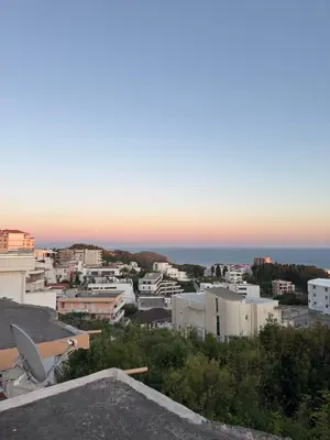 a view of a city with the ocean in the background at Velic in Ulcinj