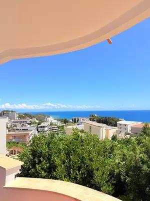 a view of the ocean from the balcony of a building at Velic in Ulcinj