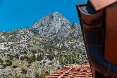 a mountain view from the window of a train at LuSi SeaView Apartment in Kotor
