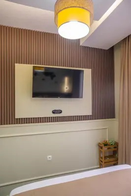 a flat screen tv on a wall in a room at Hana Apartments in Ulcinj