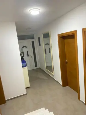 a room with a hallway with a door and a mirror at BonacaL&I in Bar
