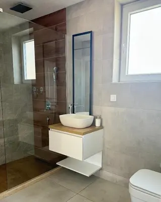 a bathroom with a sink and a shower at BonacaL&I in Bar